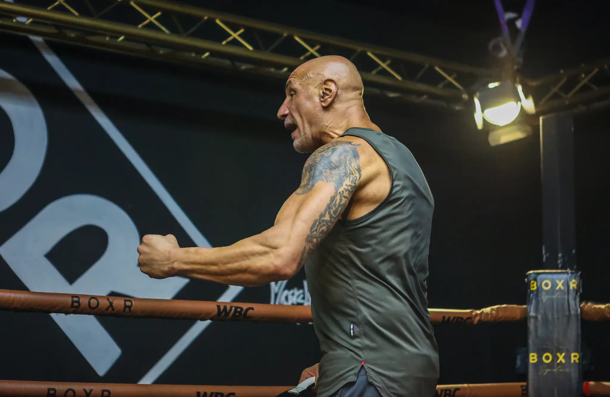 Donato De Martiis working mitts with a fighter